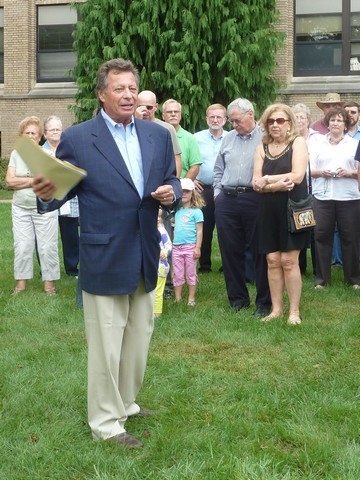 Roy Young welcomed the group and explained the process for planting the tree.