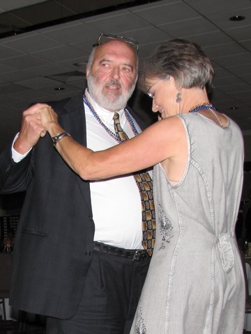 Charlie Kroha dances with his wife.